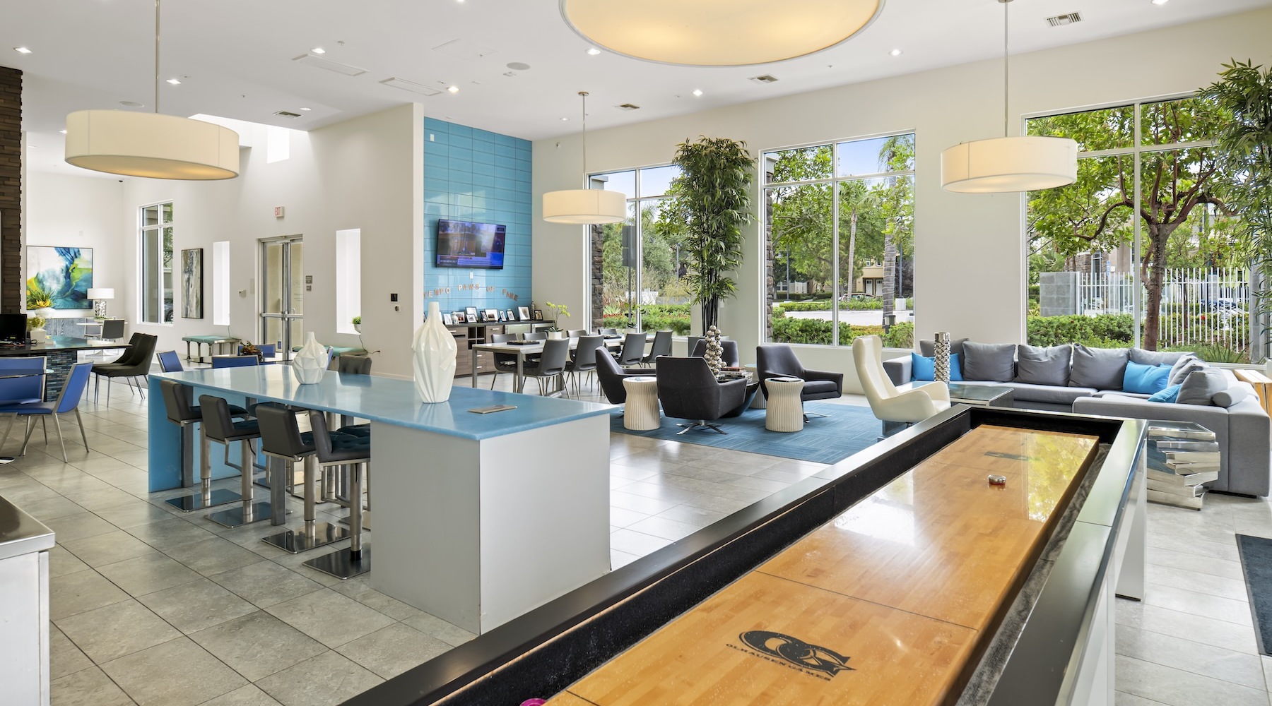 a clubroom with tables, chairs and a table game