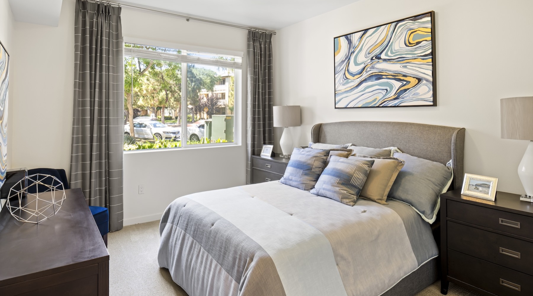 a bedroom with a bed and two nightstands