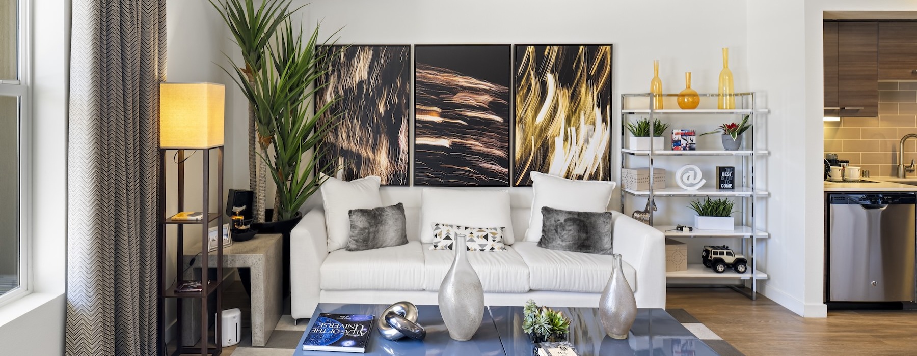 a living room with a couch and a large painting